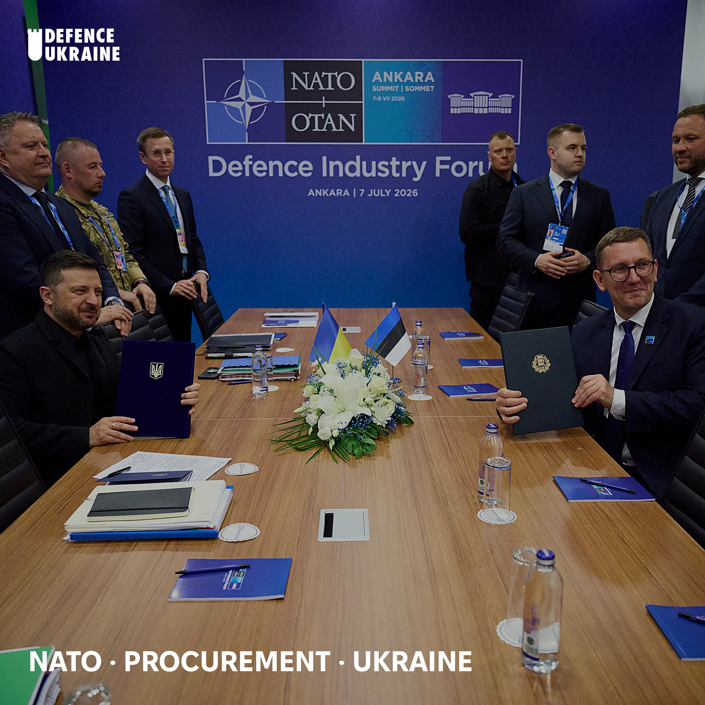 President Volodymyr Zelensky and Estonian minister Kristen Michal sign a bilateral drone-production agreement at the NATO Summit Defence Industry Forum in Ankara on 7 July 2026, with Ukrainian and Estonian flags on the table.