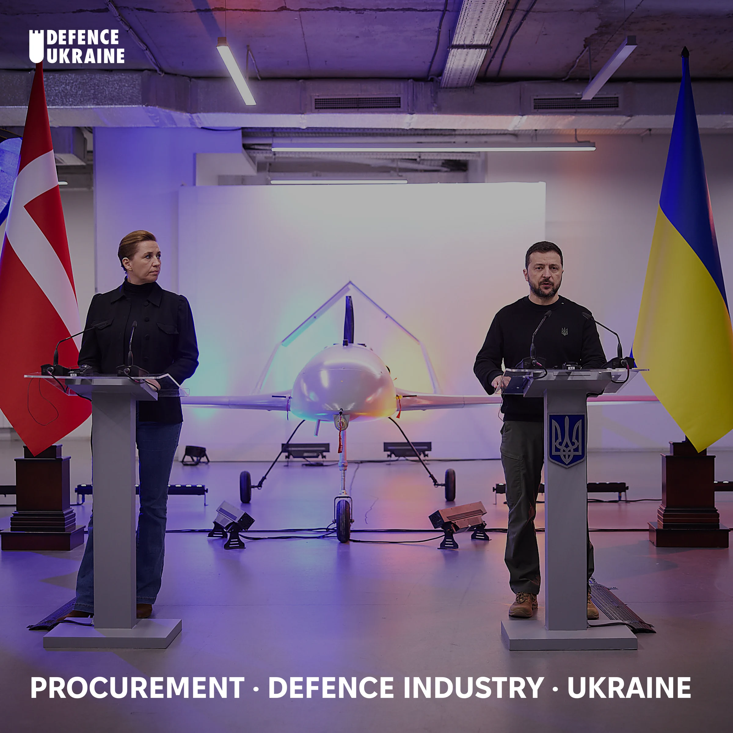Ukrainian President Volodymyr Zelensky and Danish Prime Minister Mette Frederiksen at podiums during a joint press conference on 19 November 2024, with a Ukrainian long-range strike drone financed under the Danish Model displayed between them.