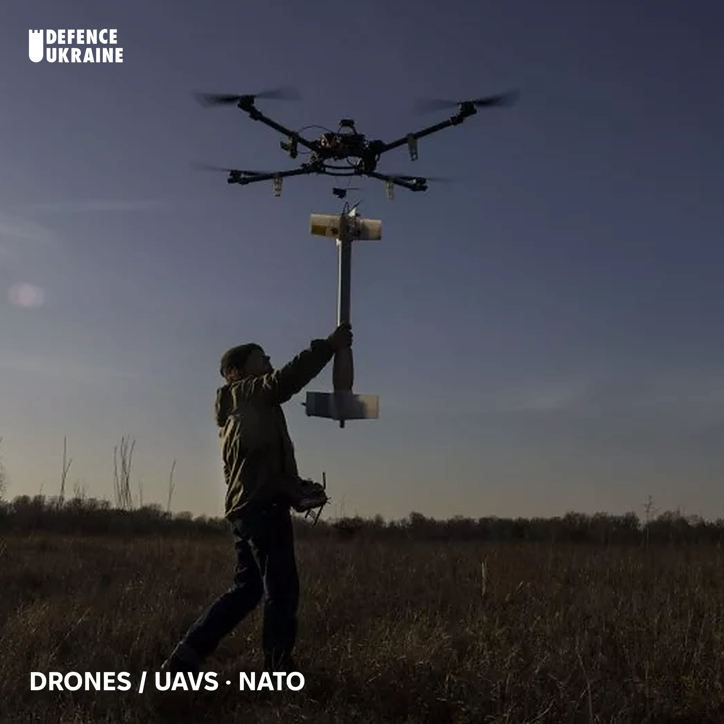 A soldier launches a quadcopter carrying an explosive payload at dusk on a prairie, illustrating the class of reconnaissance and strike drones NATO's planned Eastern Flank Drone Wall would detect and neutralise.