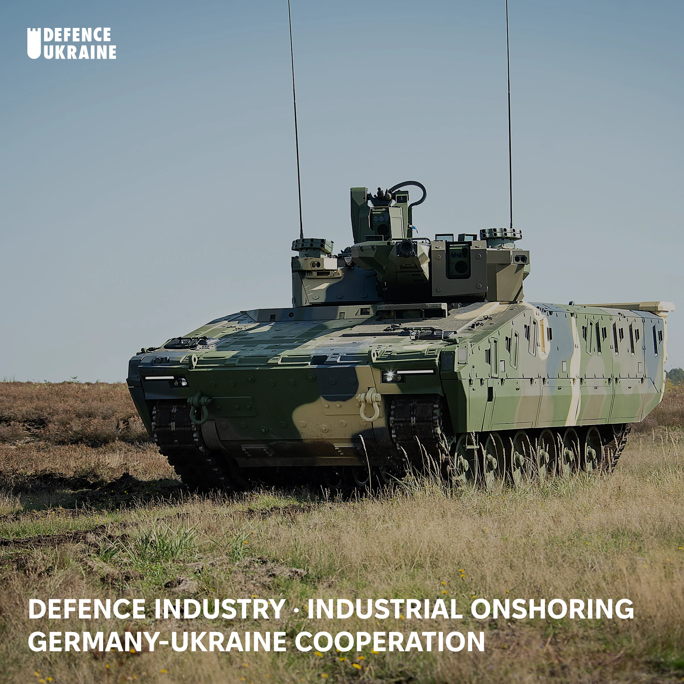 A Hungarian Lynx KF-41 infantry fighting vehicle on a grass field with a clear sky, the platform Rheinmetall has contracted to assemble for the Ukrainian Armed Forces.