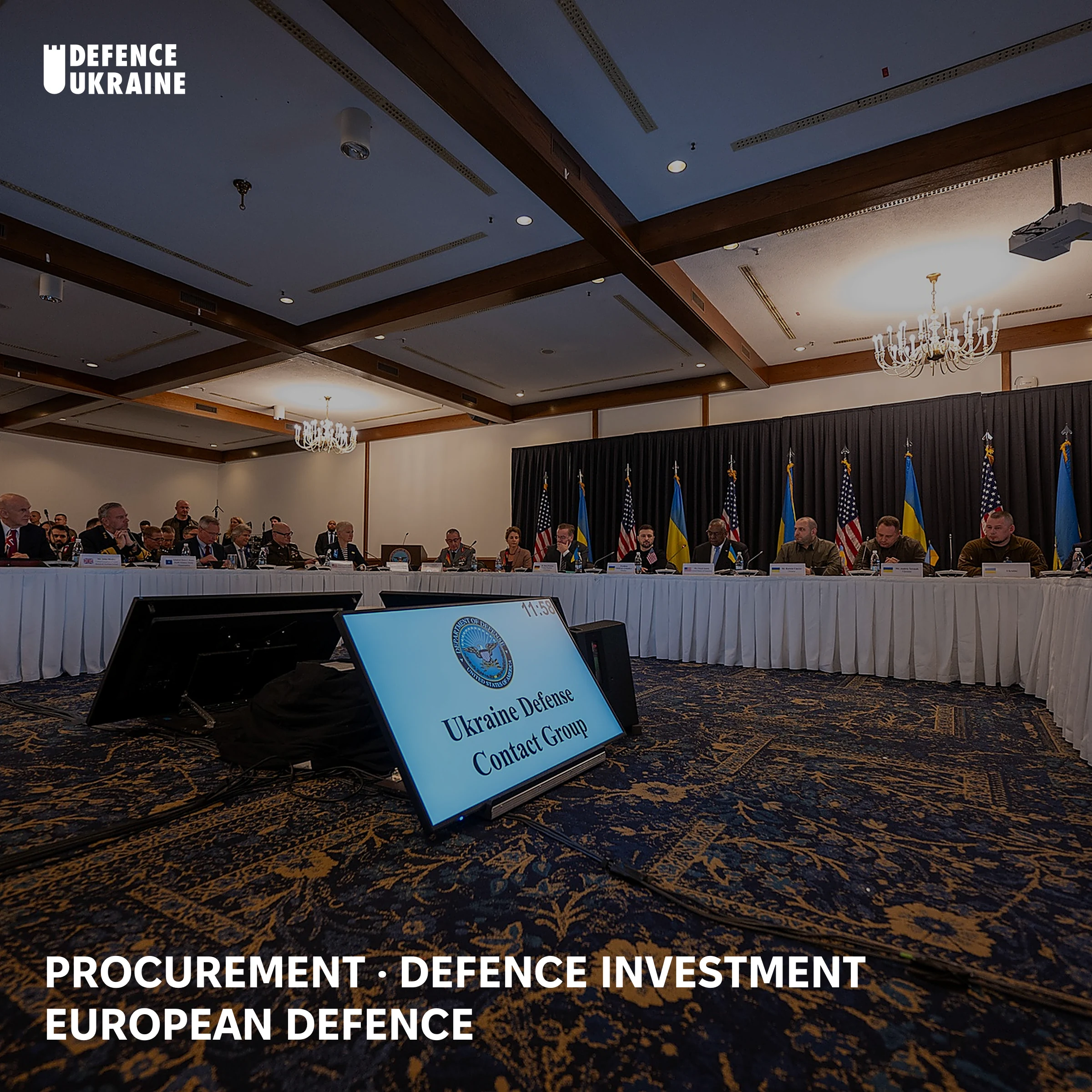 Delegations from nearly 50 nations seated around a horseshoe table at a Ukraine Defense Contact Group meeting at Ramstein Air Base, the format through which allied defence funding for Ukraine is coordinated.