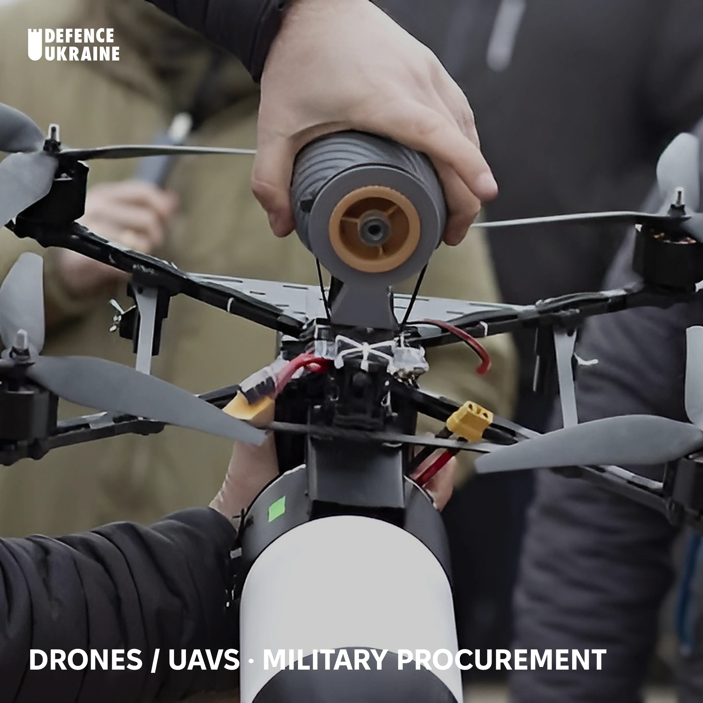 A Ukrainian operator assembles a fibre-optic-controlled FPV drone in the field, fitting the payload and fibre-spool module that makes the platform immune to Russian electronic warfare and radio jamming.